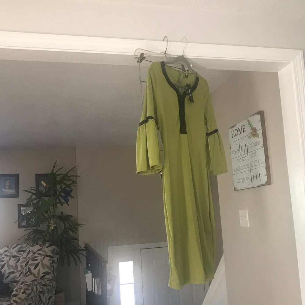 Green 3/4 sleeve dress with tag. Black trim
